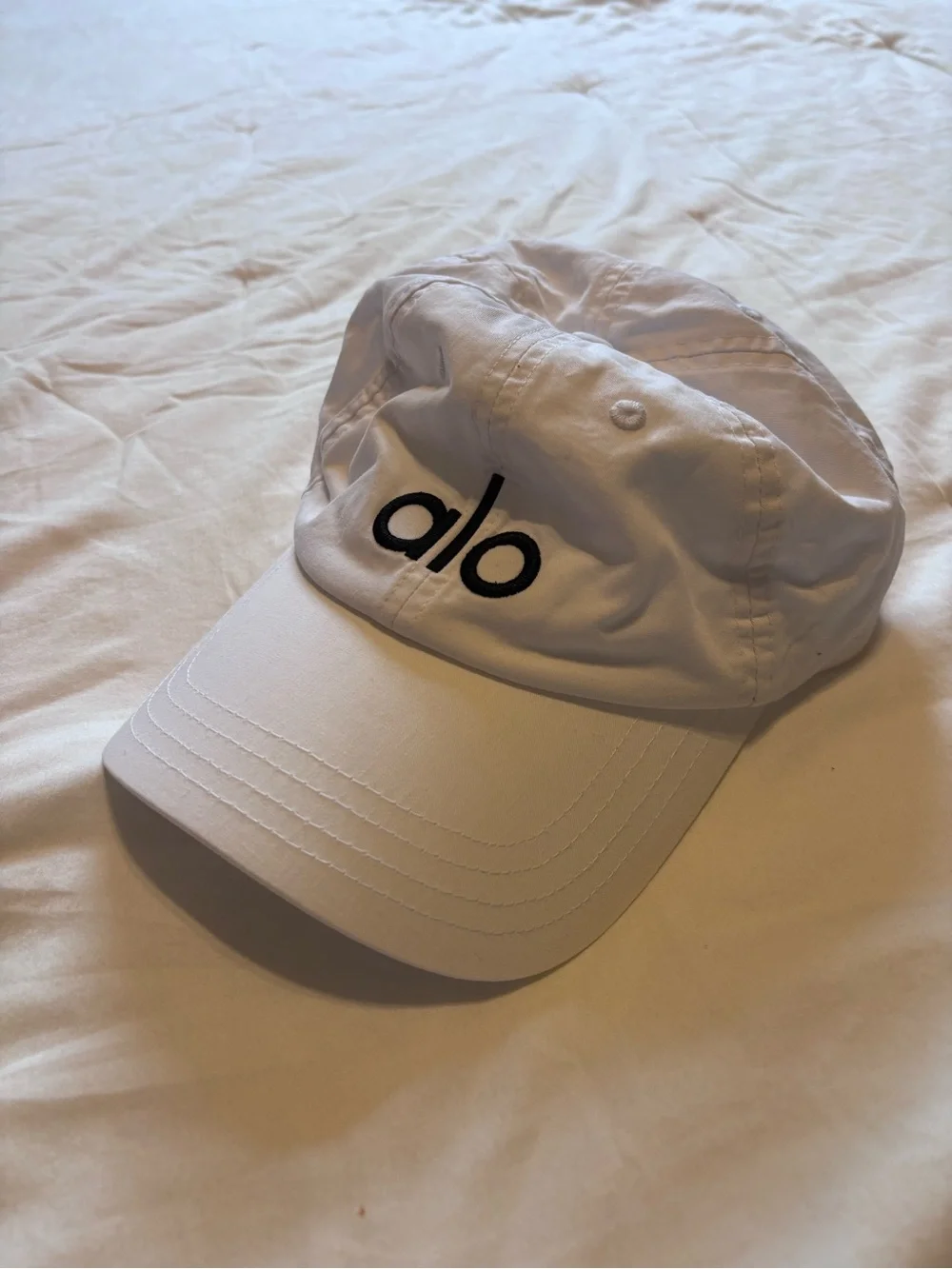 ALO Yoga Women’s White Cap with Black Logo